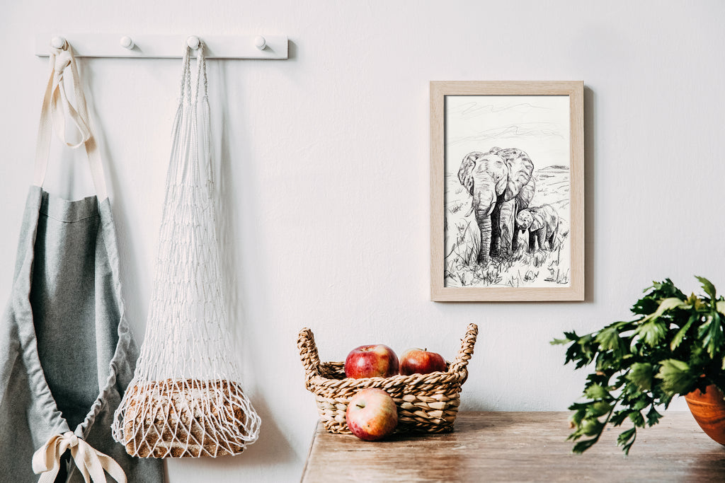 Framed artwork of Elephants on wall in kitchen